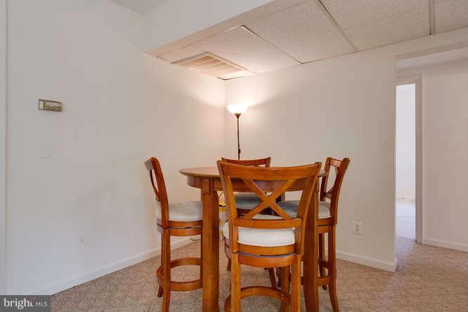 1924 North Rhodes Street, Unit 88 Arlington, VA 22201 - Photo 7 of 20 a dining room with furniture and wooden floor