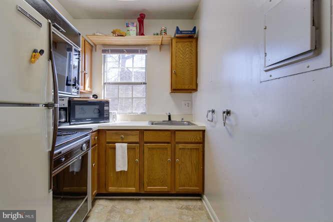 1924 North Rhodes Street, Unit 88 Arlington, VA 22201 - Photo 8 of 20 a utility room with a sink a washer and dryer