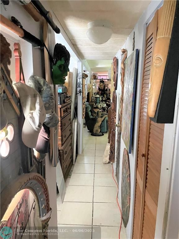 1830 Southwest 83rd Terrace Davie, FL 33324 - Photo 5 of 15 a view of walk in closet with clothes and shoes