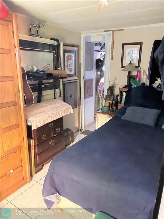 1830 Southwest 83rd Terrace Davie, FL 33324 - Photo 6 of 15 a bed room with a bed and furniture