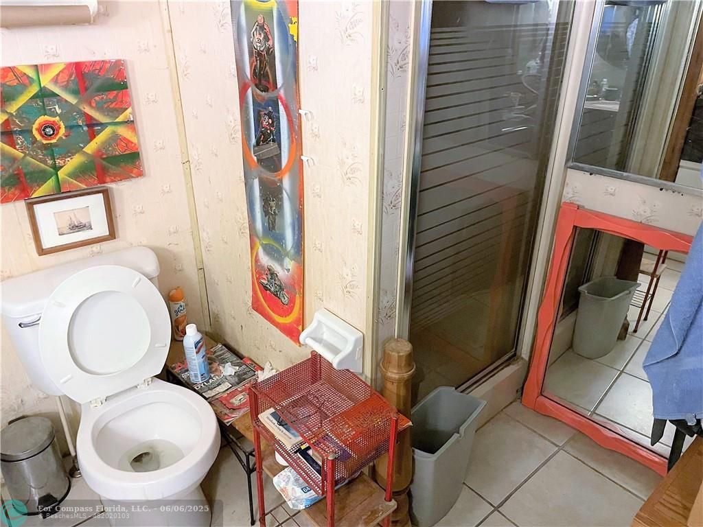 1830 Southwest 83rd Terrace Davie, FL 33324 - Photo 8 of 15 a bathroom with a toilet and a sink