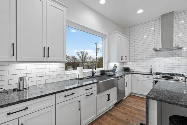 a kitchen with sink and cabinets