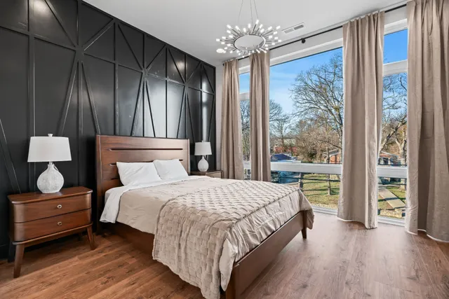 a bedroom with a large bed and a window