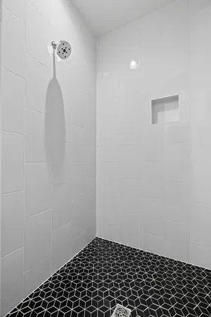 a white tub sitting in a bathroom