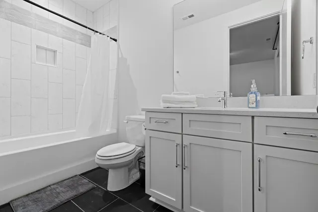 a bathroom with a shower and a toilet