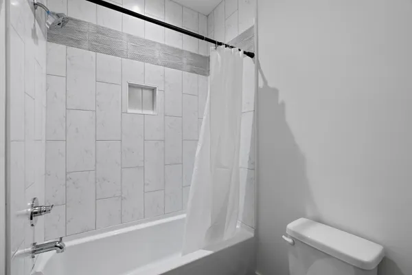 a bathroom with a sink toilet and mirror