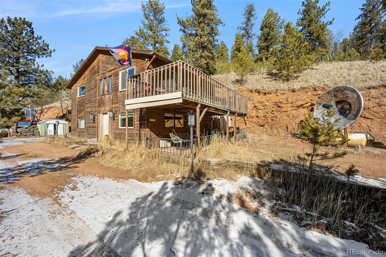 415 Bishop Road Bailey, CO 80421 - Photo 2 of 39 a view of a house with a yard