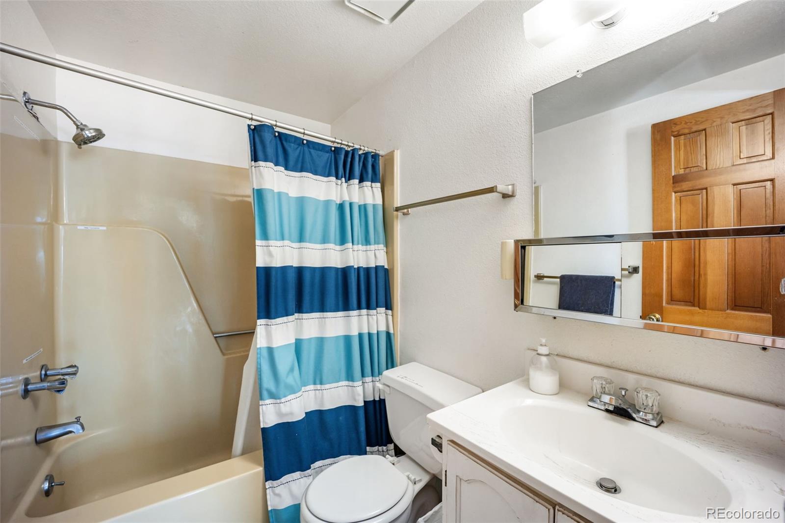 415 Bishop Road Bailey, CO 80421 - Photo 22 of 39 a bathroom with a sink toilet and shower
