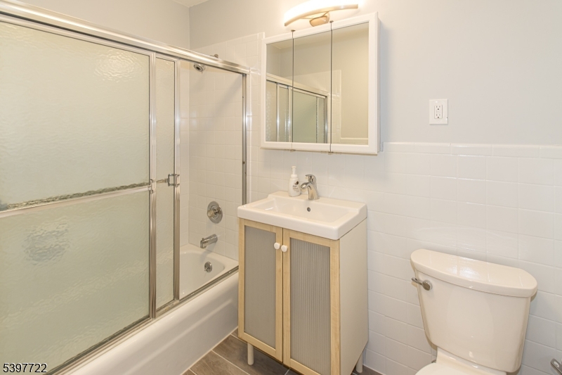 530 Park Avenue, Unit 214 Scotch Plains, NJ 07076 - Photo 13 of 17 a bathroom with a sink a toilet and shower