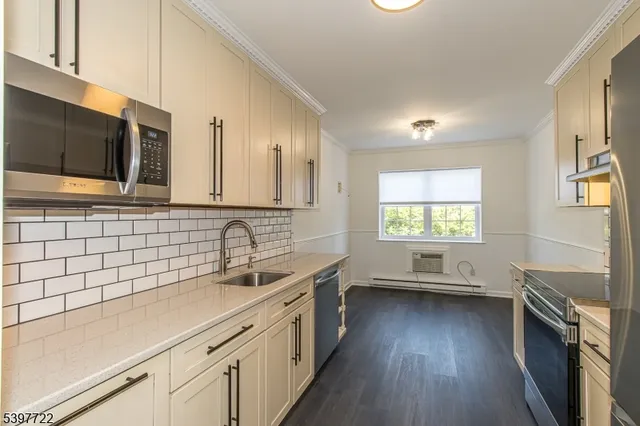 a kitchen with appliances and cabinets