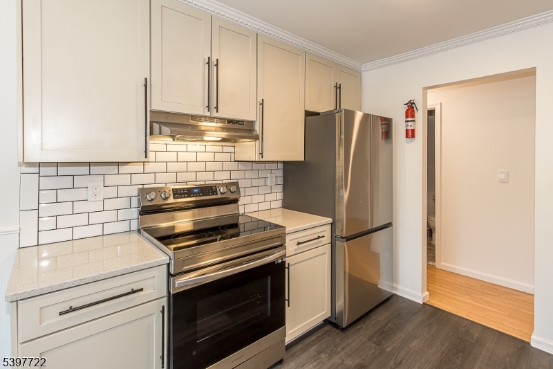 530 Park Avenue, Unit 214 Scotch Plains, NJ 07076 - Photo 4 of 17 a kitchen with appliances and cabinets