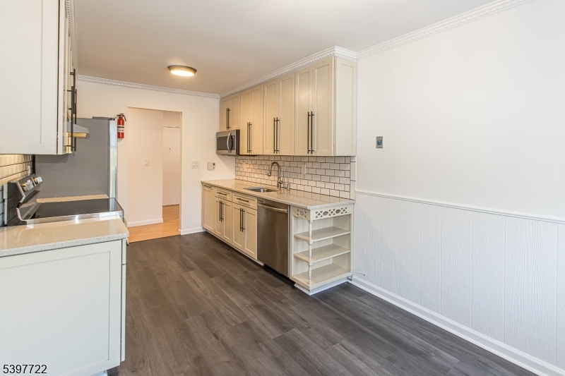 530 Park Avenue, Unit 214 Scotch Plains, NJ 07076 - Photo 5 of 17 a kitchen with stainless steel appliances a stove and a refrigerator