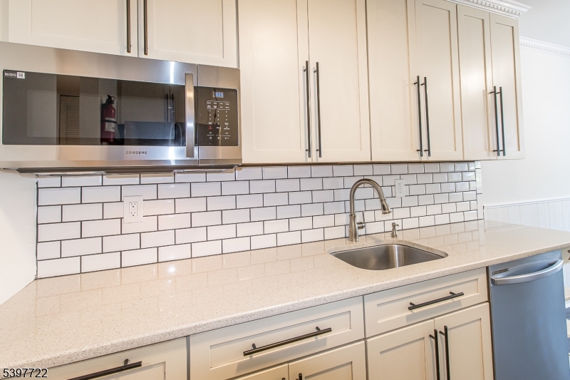 530 Park Avenue, Unit 214 Scotch Plains, NJ 07076 - Photo 7 of 17 a bathroom with a sink and a mirror