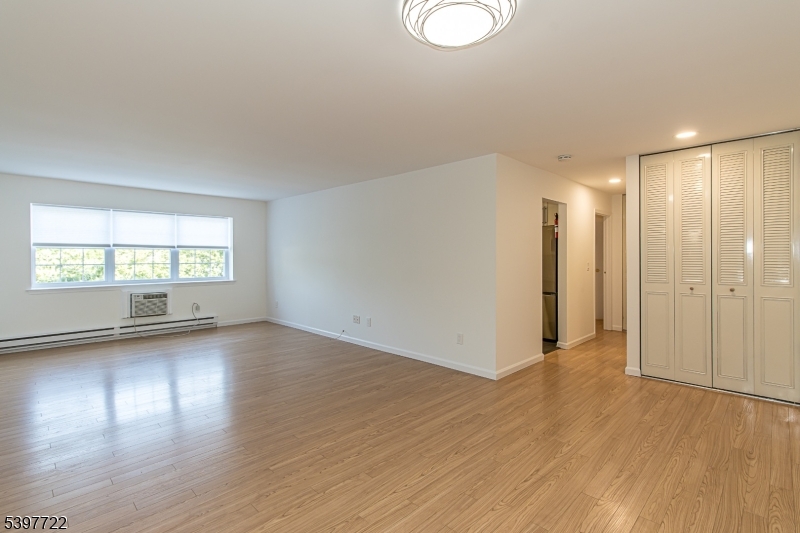 530 Park Avenue, Unit 214 Scotch Plains, NJ 07076 - Photo 10 of 17 a view of a room with wooden floor and window