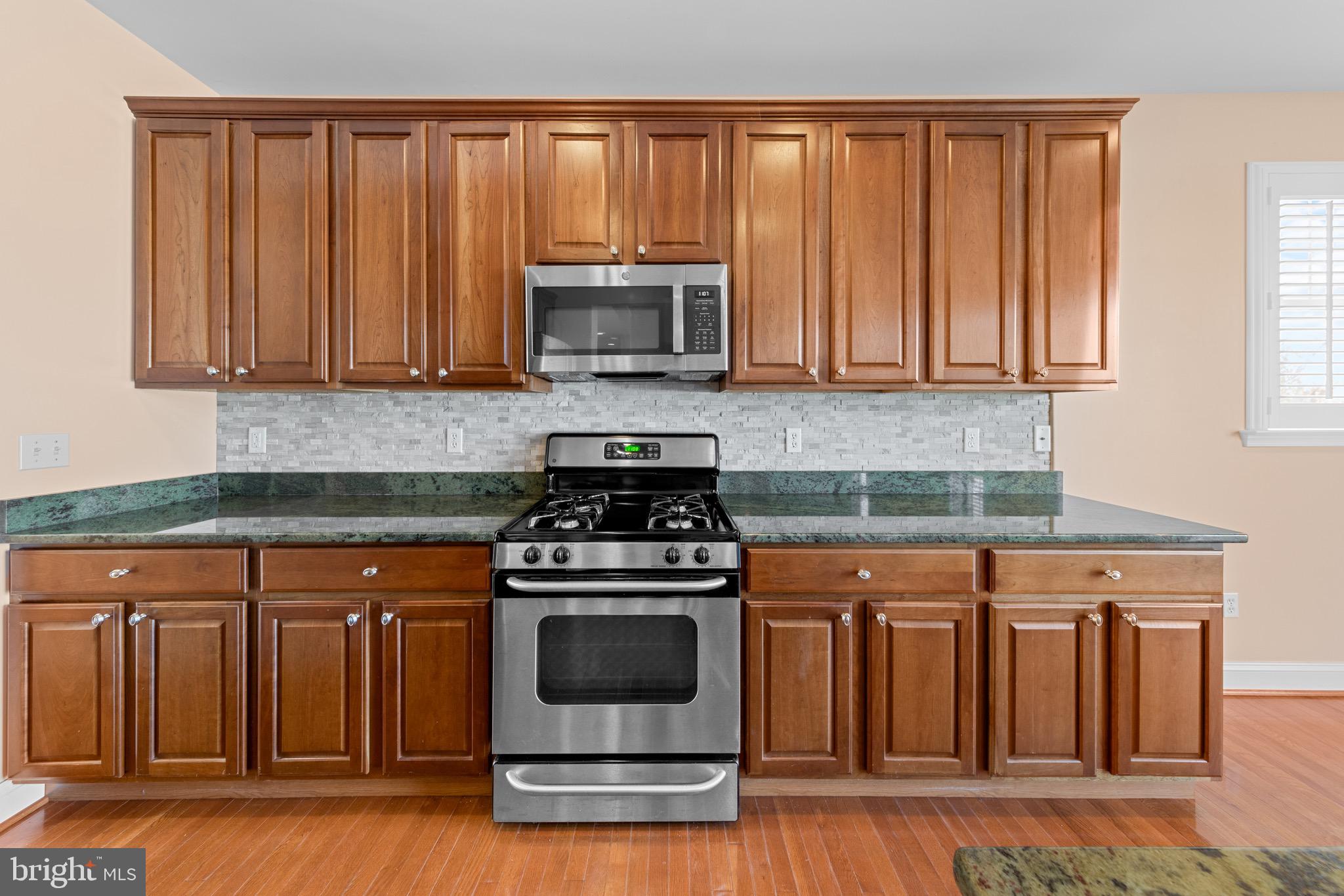 31436 Waters Way Lewes, DE 19958 - Photo 19 of 70 Gas stove, 42 inch cabinets and granite counters