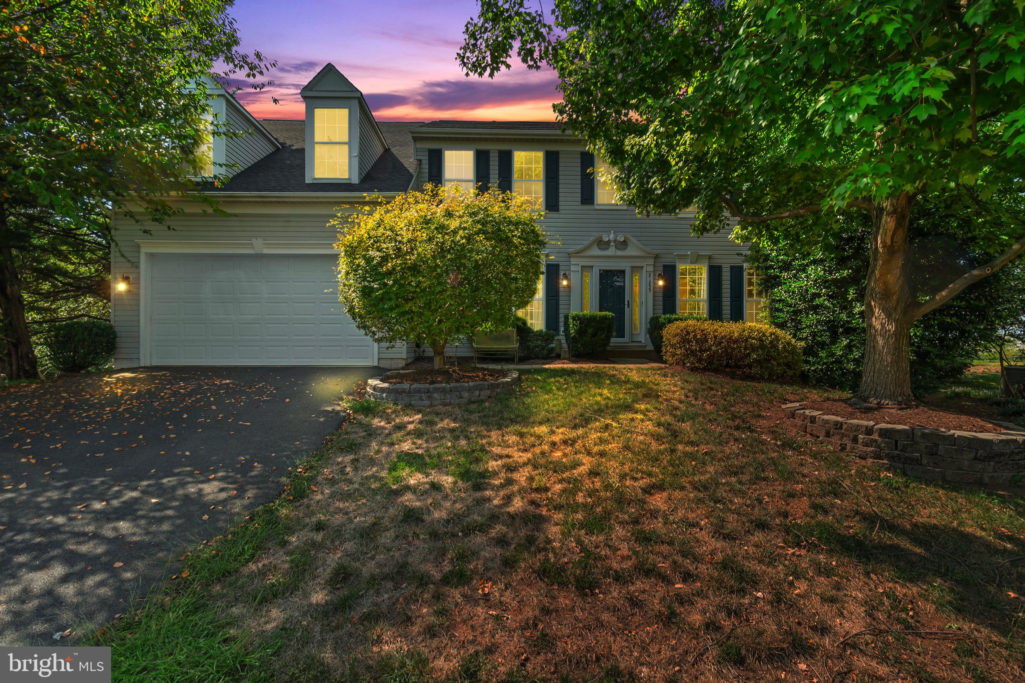 21255 Olive Green Court Ashburn, VA 20147 - Photo 2 of 32 a front view of a house with garden