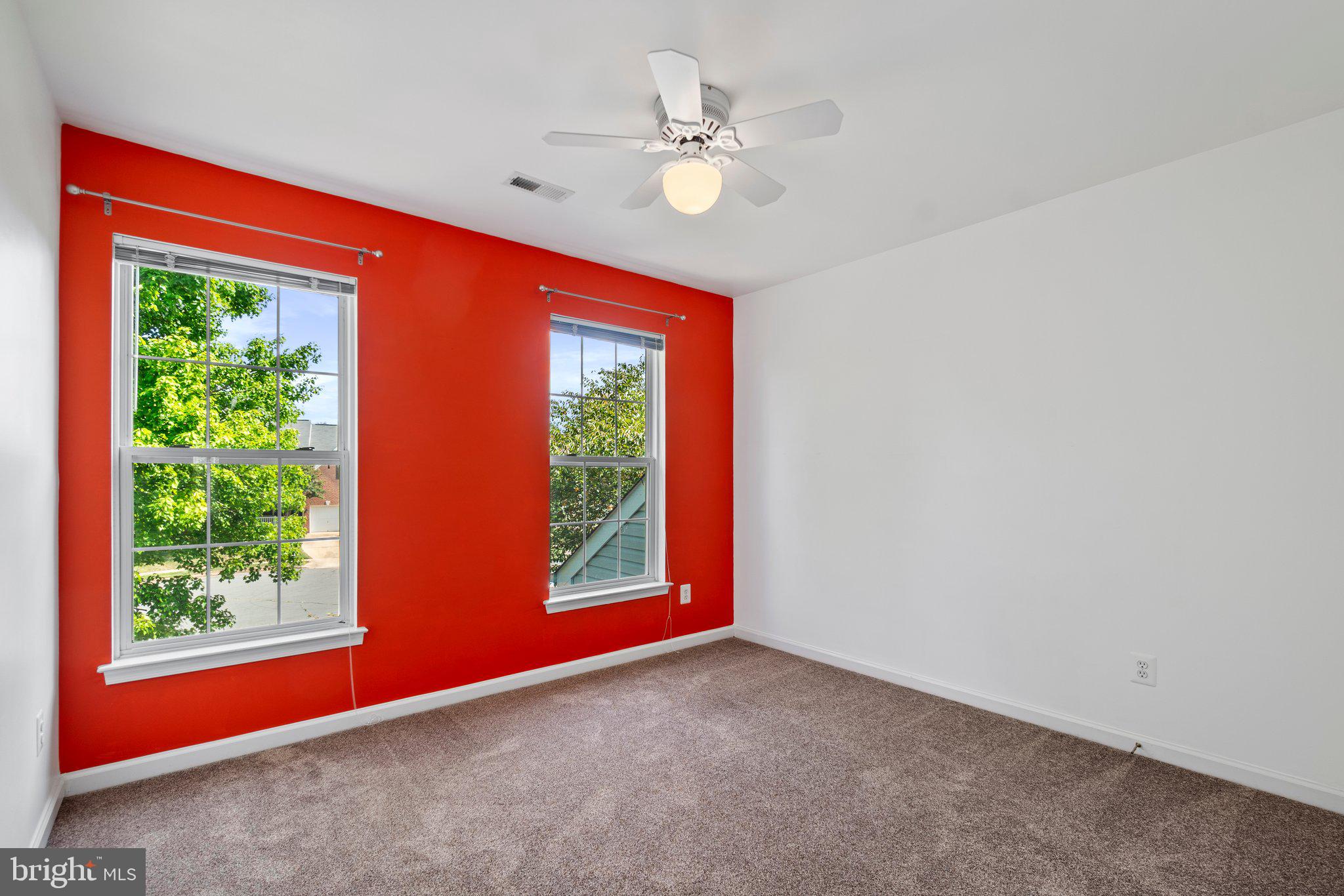 21255 Olive Green Court Ashburn, VA 20147 - Photo 22 of 32 wooden floor in an empty room with a window