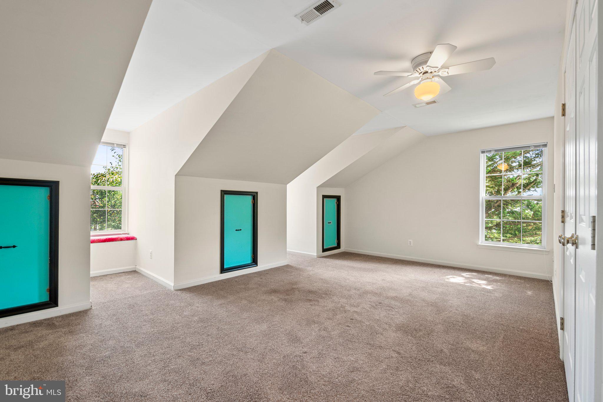 21255 Olive Green Court Ashburn, VA 20147 - Photo 24 of 32 an empty room with windows and fan