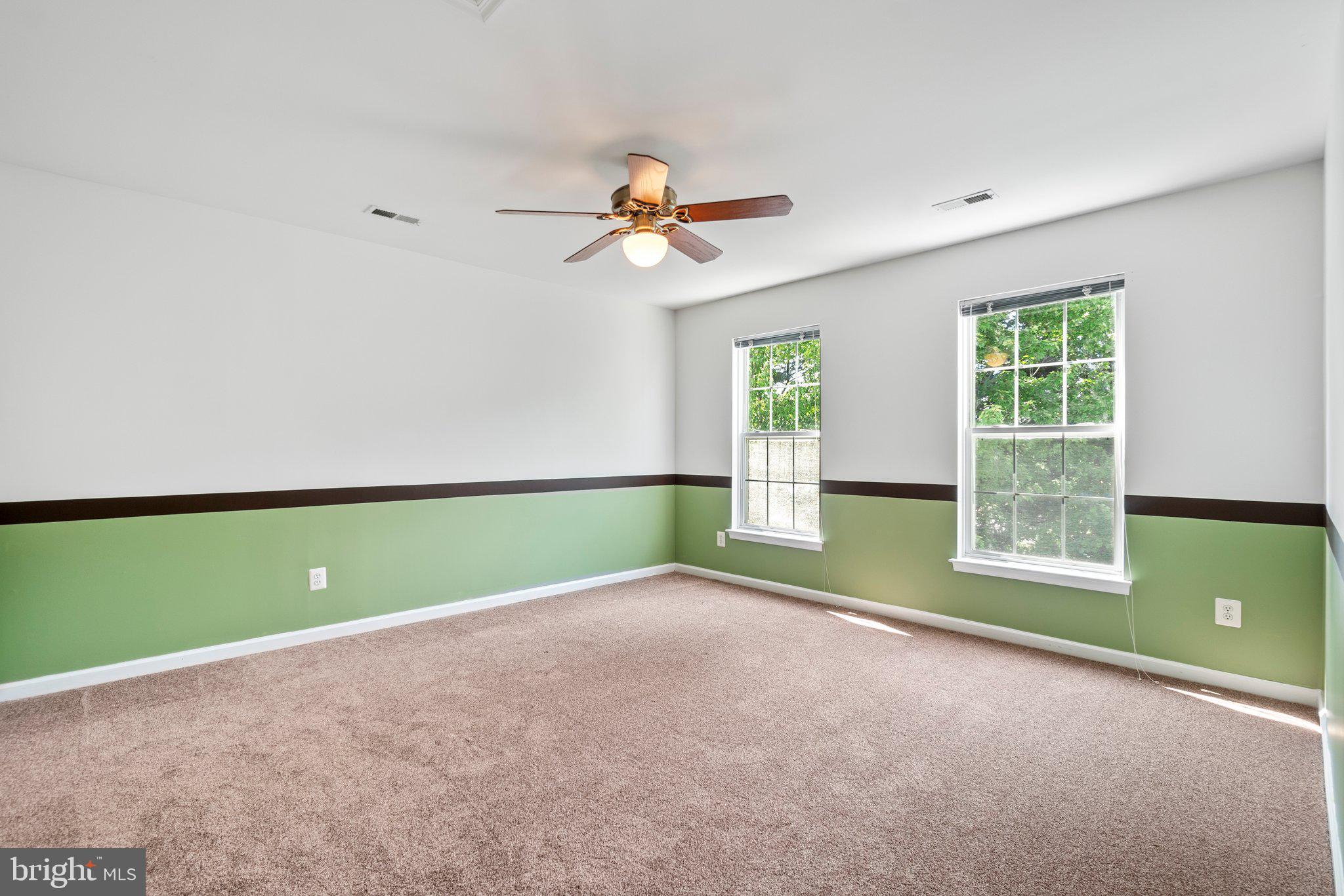 21255 Olive Green Court Ashburn, VA 20147 - Photo 25 of 32 a view of a room with windows and fan