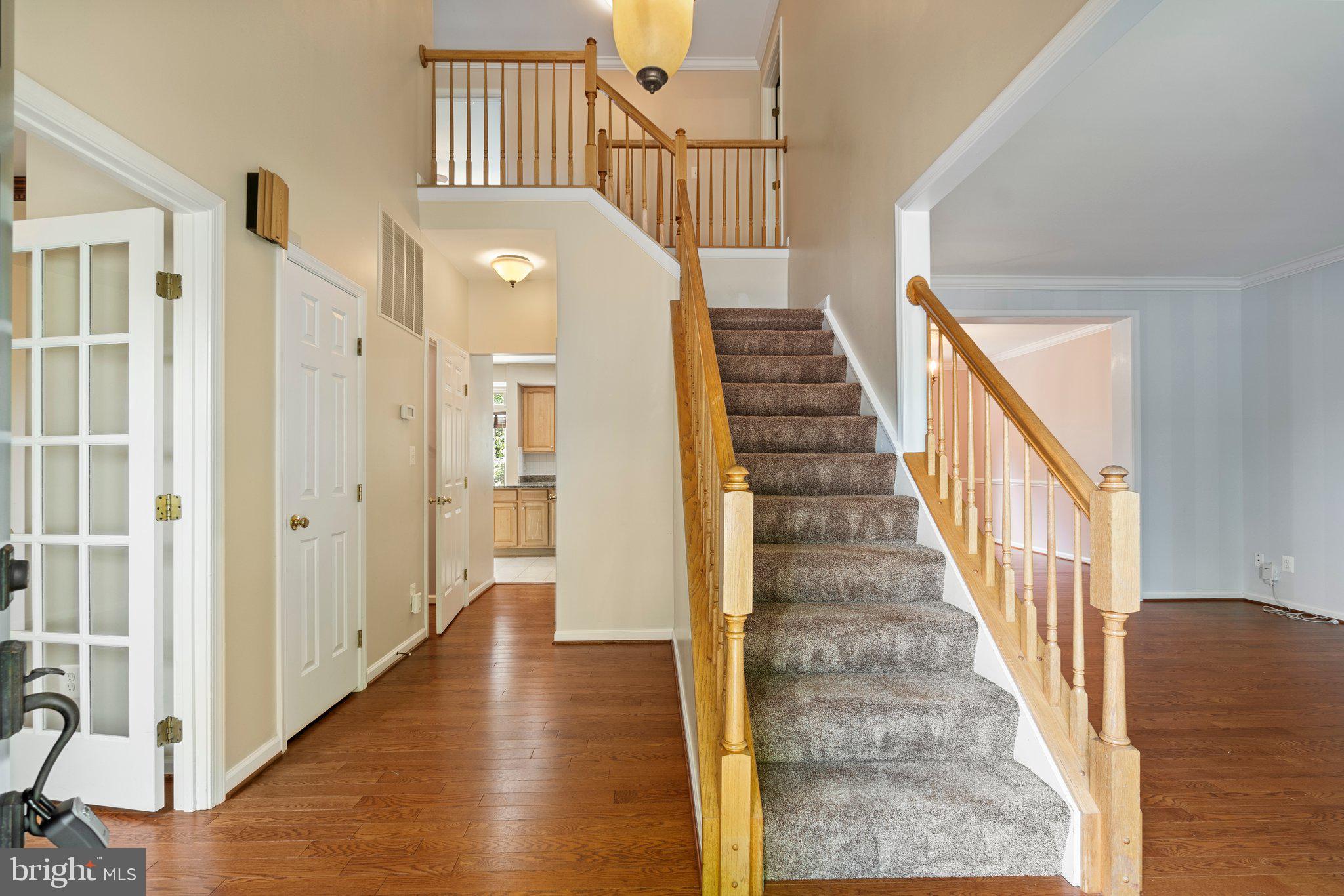 21255 Olive Green Court Ashburn, VA 20147 - Photo 4 of 32 a view of an entryway with wooden floor