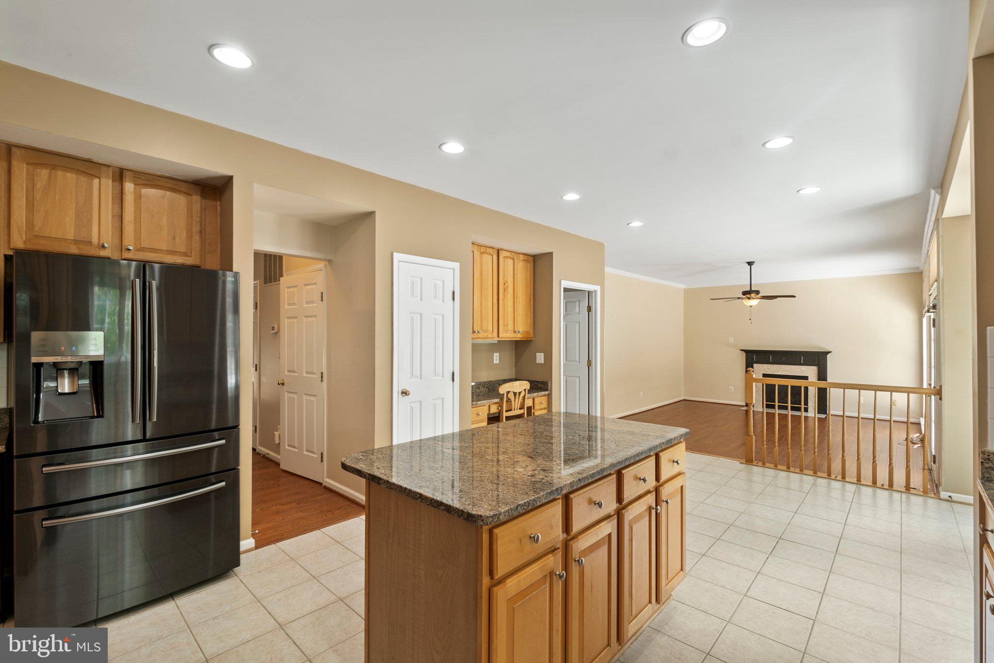21255 Olive Green Court Ashburn, VA 20147 - Photo 8 of 32 a kitchen with stainless steel appliances granite countertop a refrigerator and a stove top oven