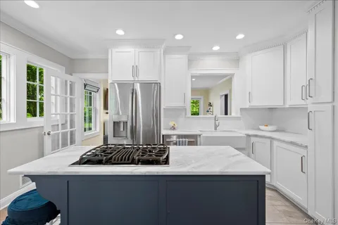 a kitchen with a sink stove and refrigerator