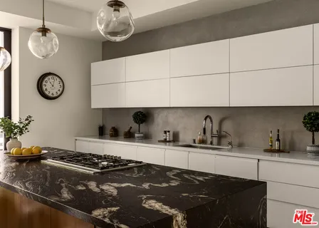 a kitchen with a stove a refrigerator and a sink