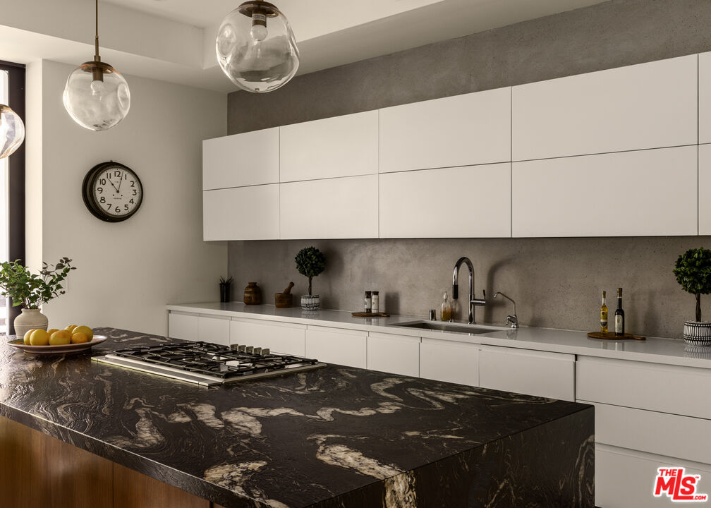 6509 Colgate Avenue Los Angeles, CA 90048 - Photo 11 of 36 a kitchen with a stove a refrigerator and a sink