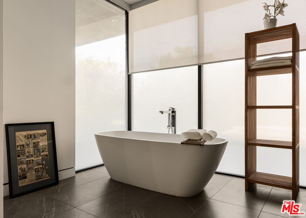 6509 Colgate Avenue Los Angeles, CA 90048 - Photo 18 of 36 a living room with a window and a glass door