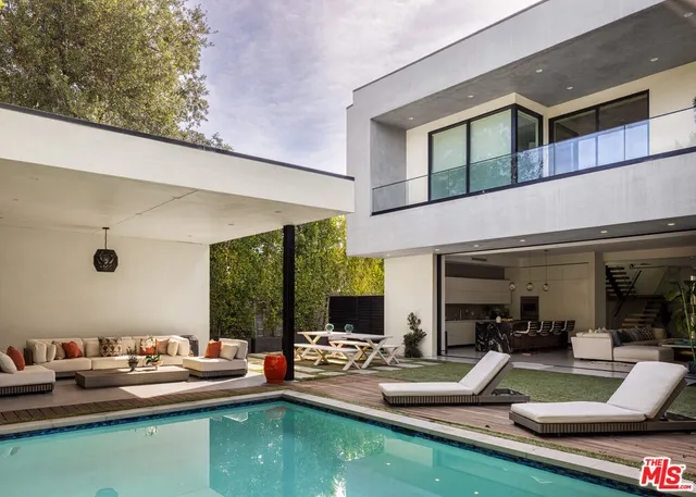 a view of swimming pool with outdoor seating