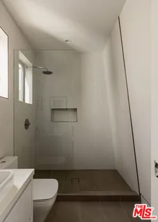 a bathroom with a sink and toilet