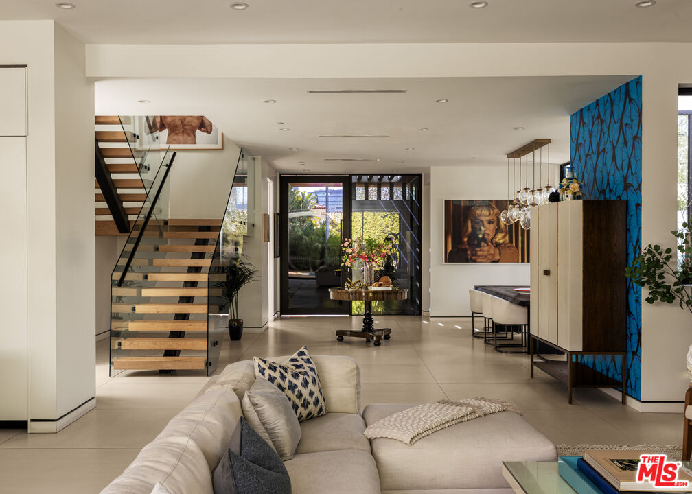 6509 Colgate Avenue Los Angeles, CA 90048 - Photo 5 of 36 a living room with furniture and a stairs