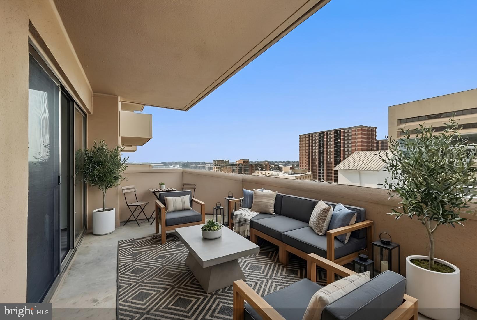 1301 North Courthouse Road, Unit 1205 Arlington, VA 22201 - Photo 16 of 33 a roof deck with patio and furniture