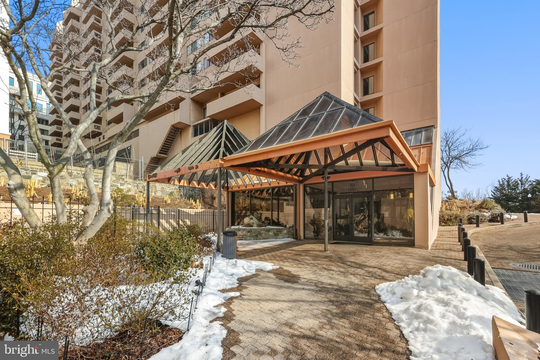 1301 North Courthouse Road, Unit 1205 Arlington, VA 22201 - Photo 23 of 30 a view of a building with a tree