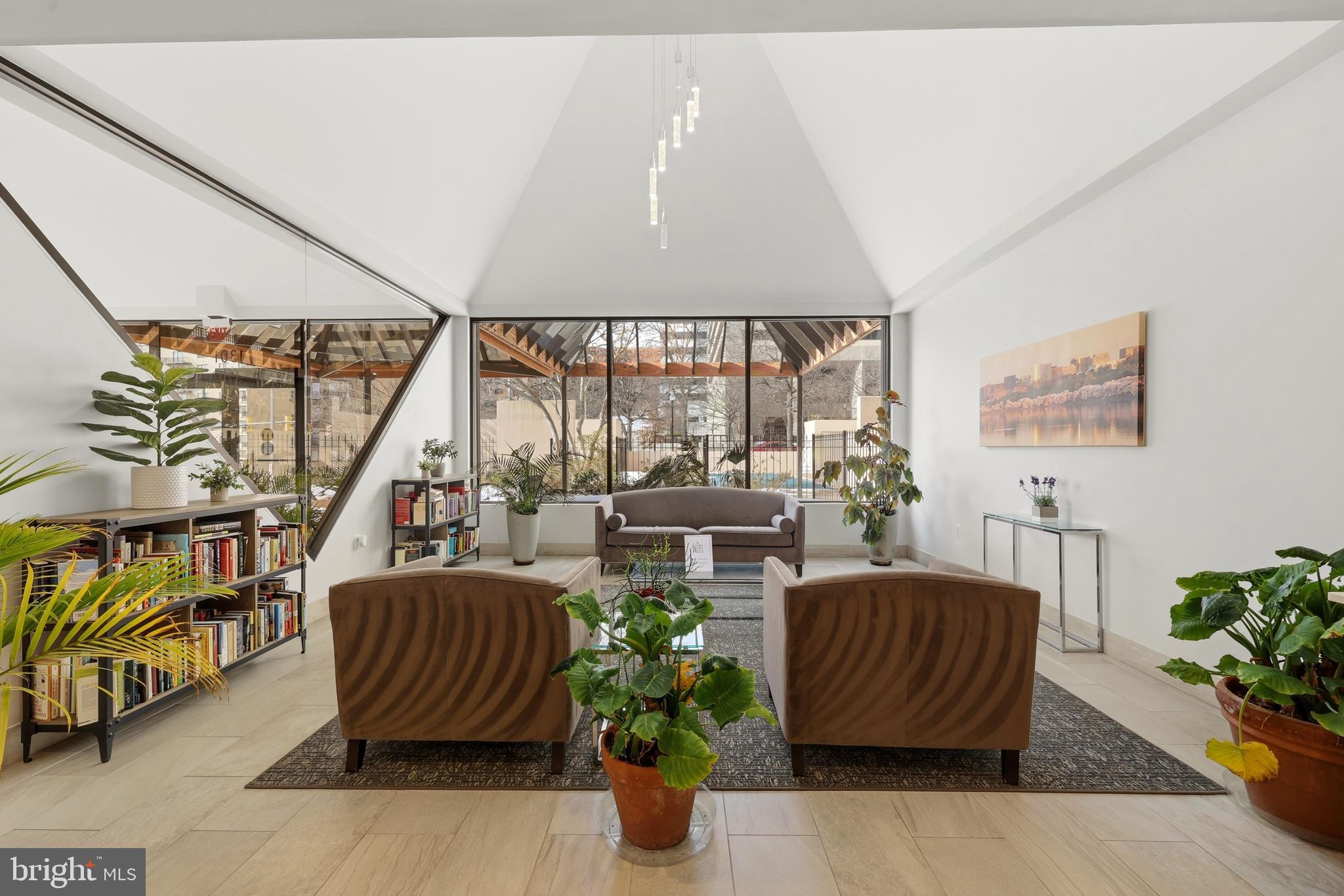 1301 North Courthouse Road, Unit 1205 Arlington, VA 22201 - Photo 23 of 33 a living room with patio furniture and a potted plant