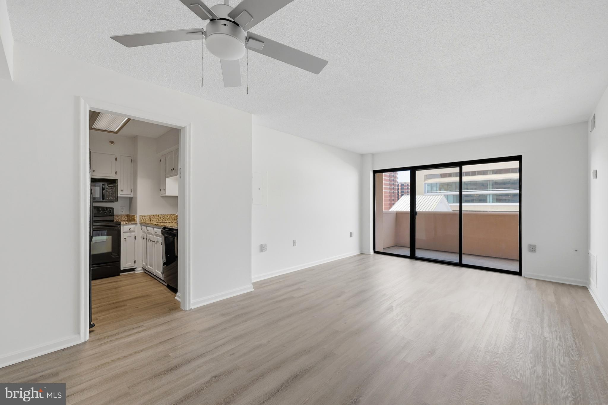 1301 North Courthouse Road, Unit 1205 Arlington, VA 22201 - Photo 4 of 33 a view of a kitchen with a sink and a refrigerator