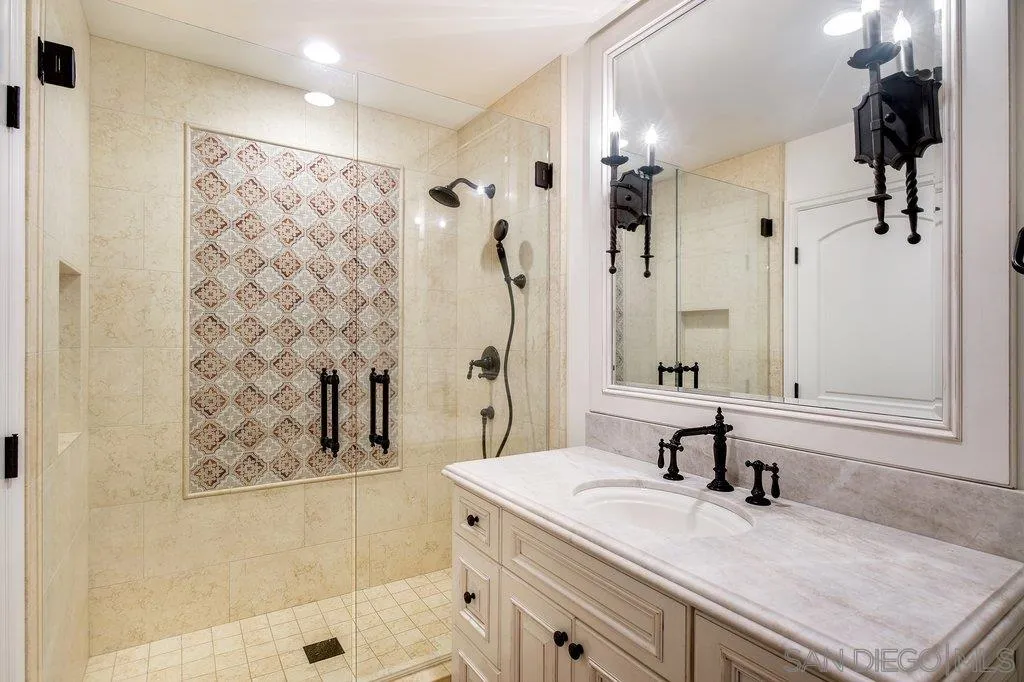 6125 La Flecha Rancho Santa Fe, CA 92067 - Photo 14 of 25 a bathroom with a granite countertop sink a shower and a mirror