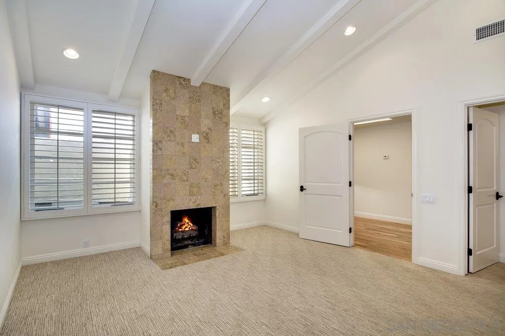 6125 La Flecha Rancho Santa Fe, CA 92067 - Photo 16 of 25 a view of an empty room with a fireplace and a window