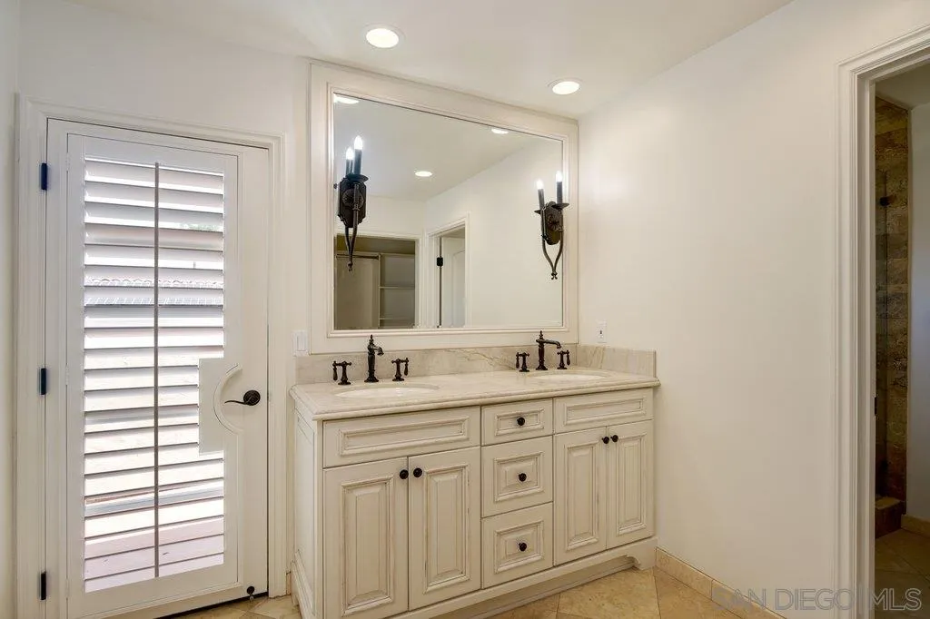 6125 La Flecha Rancho Santa Fe, CA 92067 - Photo 17 of 25 a bathroom with double sink and a mirror