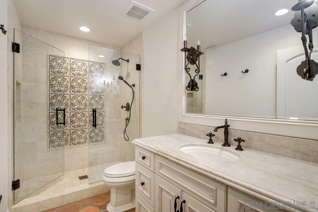 6125 La Flecha Rancho Santa Fe, CA 92067 - Photo 20 of 25 a bathroom with a sink a toilet and shower