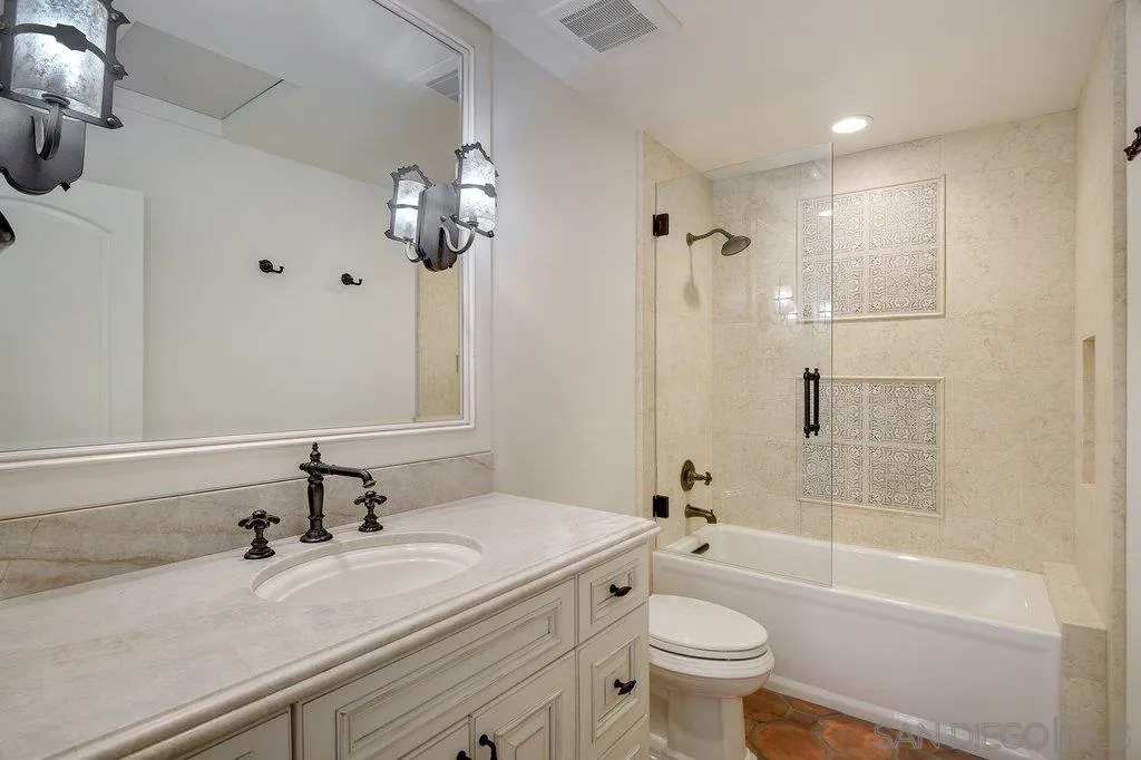 6125 La Flecha Rancho Santa Fe, CA 92067 - Photo 22 of 25 a bathroom with a sink a toilet and a mirror