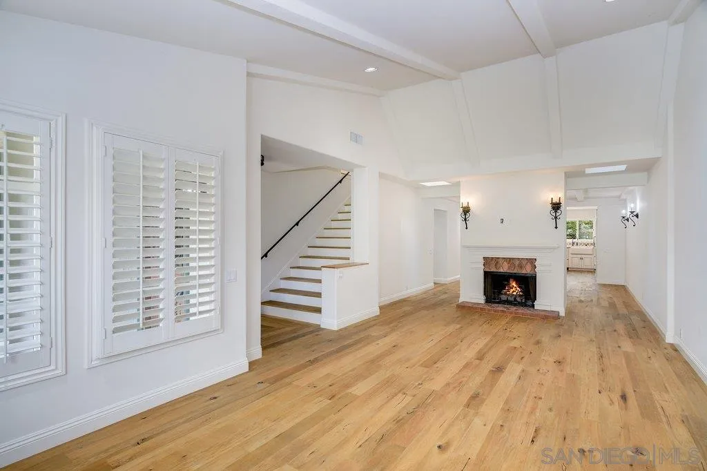 6125 La Flecha Rancho Santa Fe, CA 92067 - Photo 4 of 25 wooden floor fireplace and windows in a room