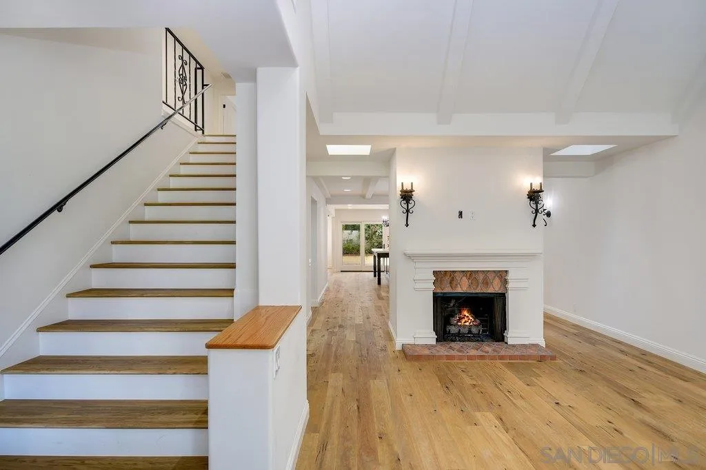6125 La Flecha Rancho Santa Fe, CA 92067 - Photo 5 of 25 a view of a livingroom with wooden floor and a fireplace
