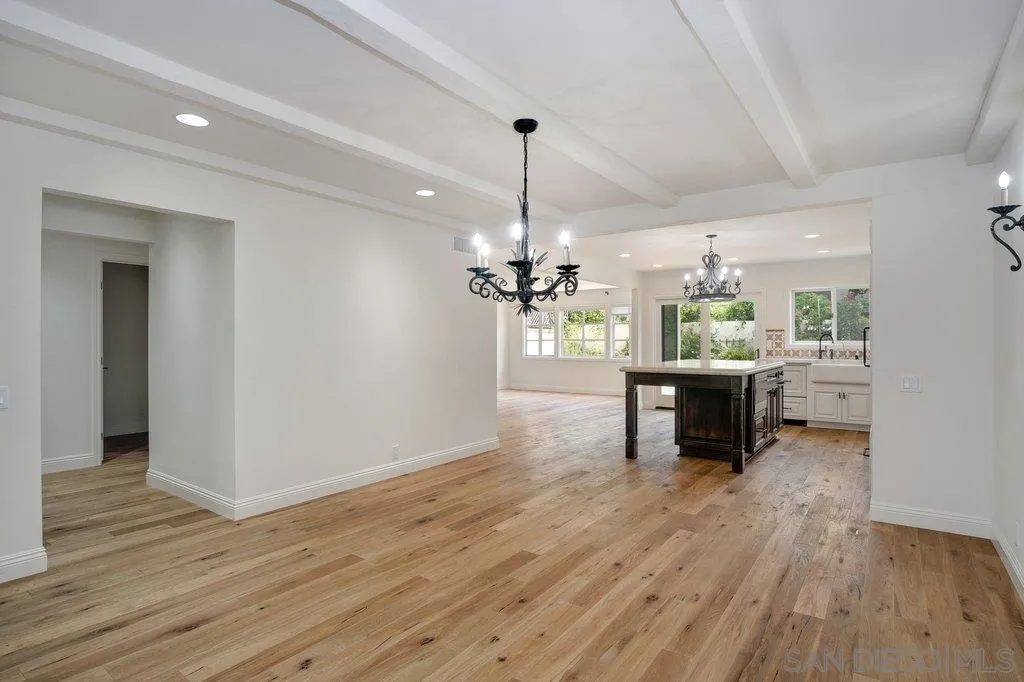 6125 La Flecha Rancho Santa Fe, CA 92067 - Photo 7 of 25 a view of a room with wooden floor and a ceiling fan