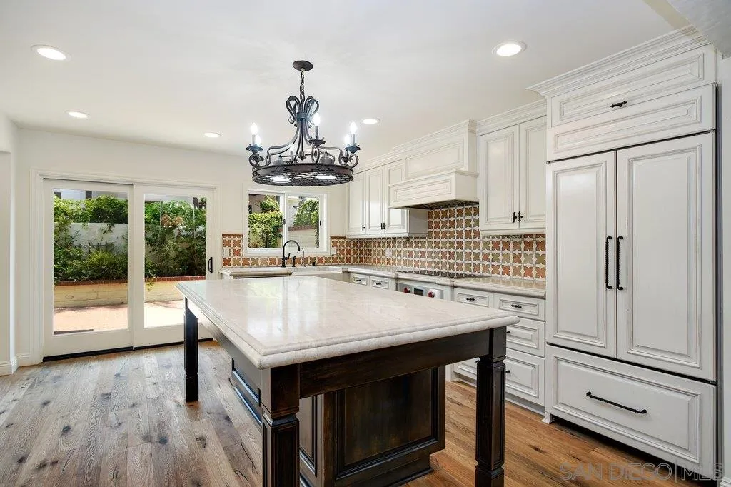 6125 La Flecha Rancho Santa Fe, CA 92067 - Photo 9 of 25 a kitchen with stainless steel appliances granite countertop a stove and a refrigerator