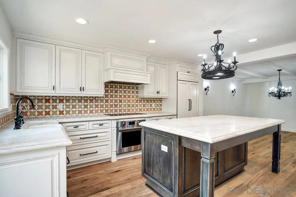 6125 La Flecha Rancho Santa Fe, CA 92067 - Photo 10 of 25 a kitchen with a stove and a chandelier