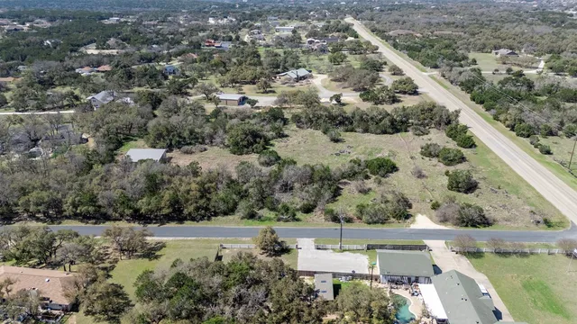 an aerial view of house with yard