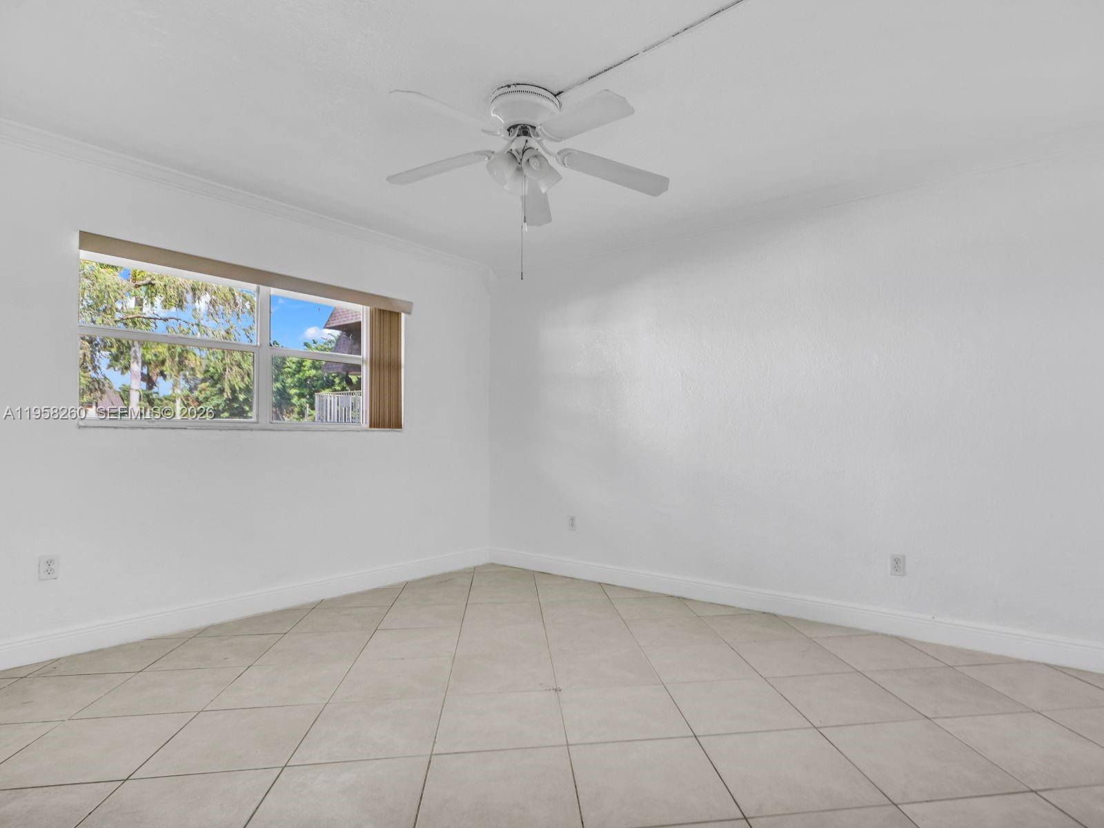8601 Southwest 94th Street, Unit 104W Miami, FL 33156 - Photo 16 of 29 wooden floor in an empty room with a window