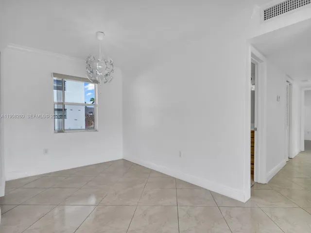 an empty room with chandelier