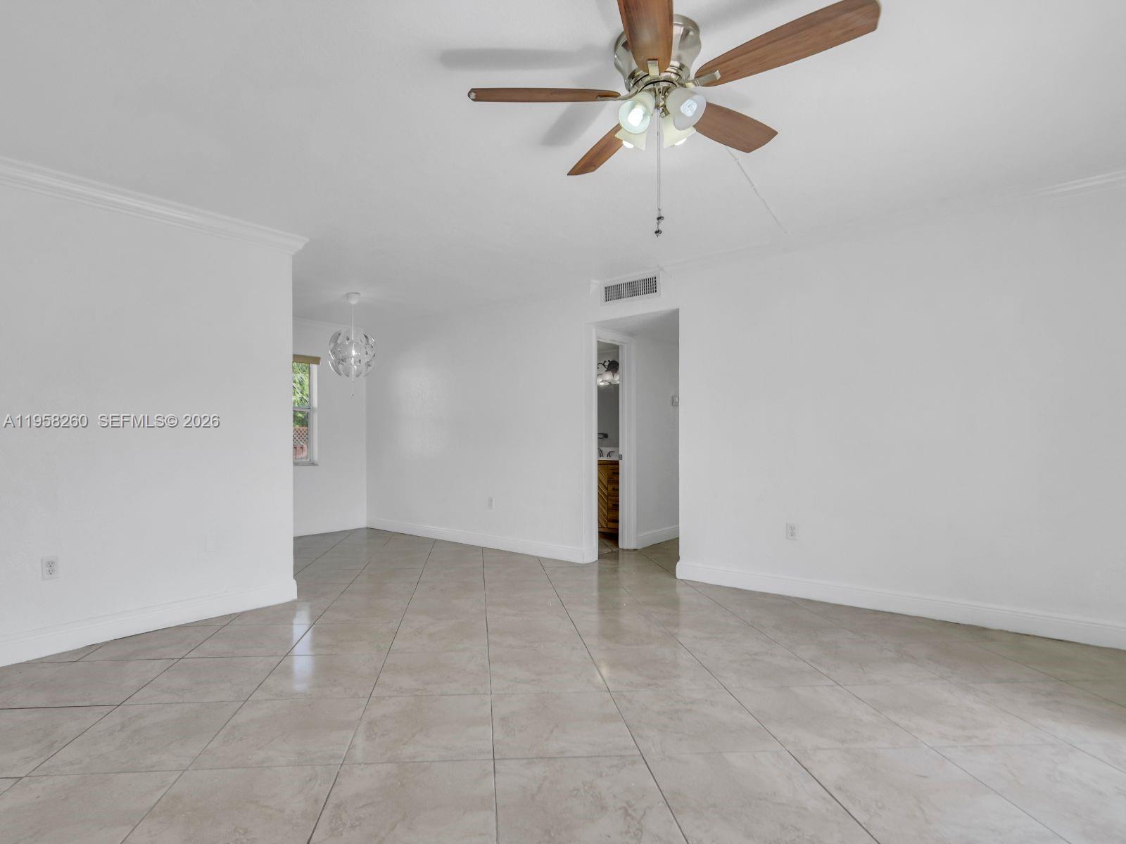 8601 Southwest 94th Street, Unit 104W Miami, FL 33156 - Photo 23 of 29 wooden floor in an empty room